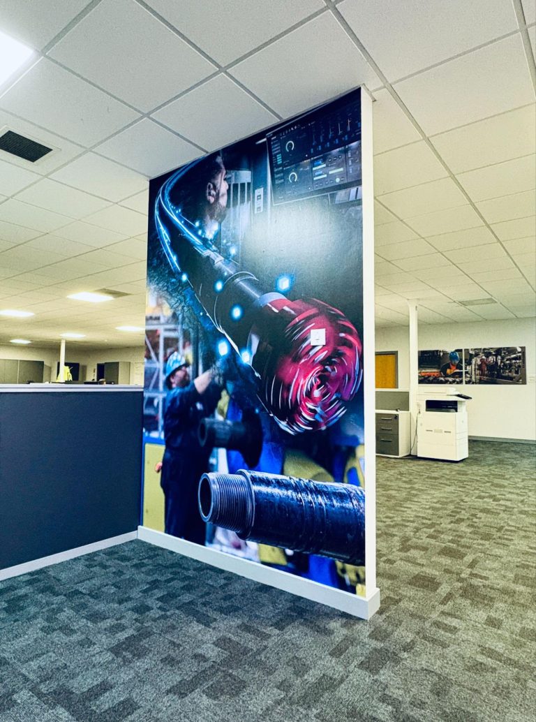 Office pillar in the middle of the NOV office with an oil & gas visual displayed.