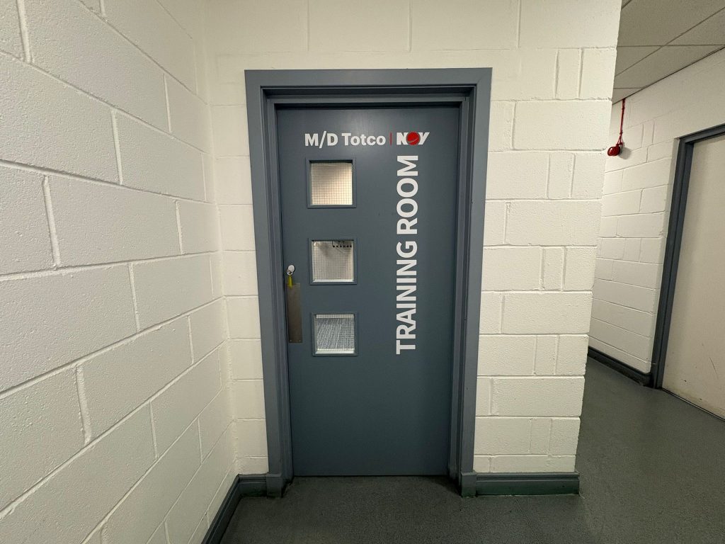 Image of entrance door to NOV training room.